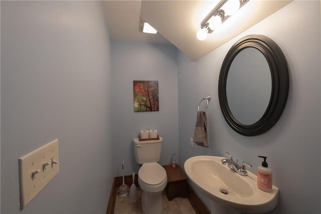 bathroom with sink, tile patterned floors, and toilet