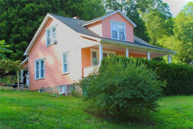 view of home's exterior featuring a yard