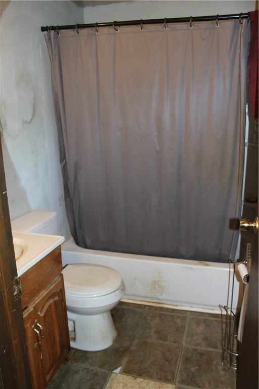 full bathroom featuring vanity, tile patterned flooring, shower / bath combination with curtain, and toilet