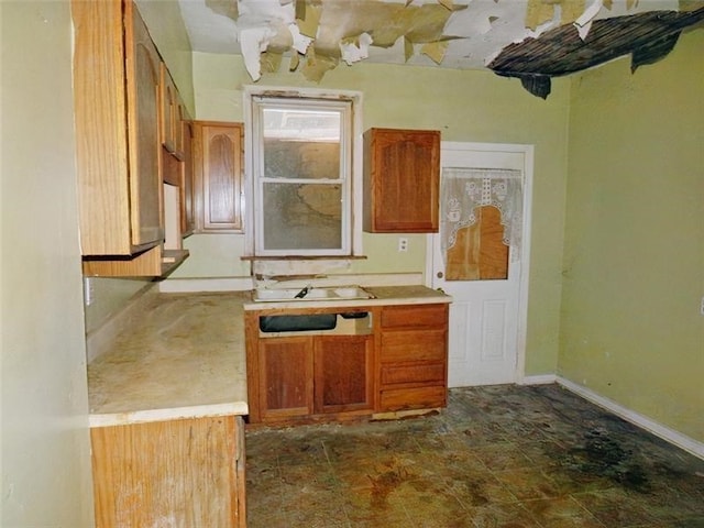 kitchen with sink and dark tile patterned floors