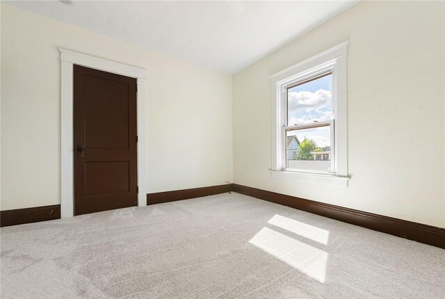 unfurnished room with carpet floors