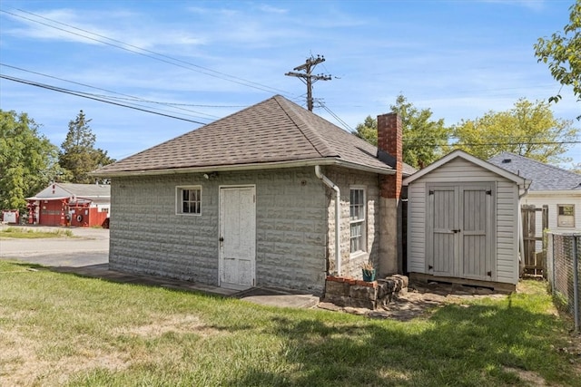 view of outdoor structure featuring a lawn