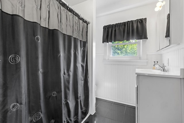 bathroom with tile patterned floors and vanity