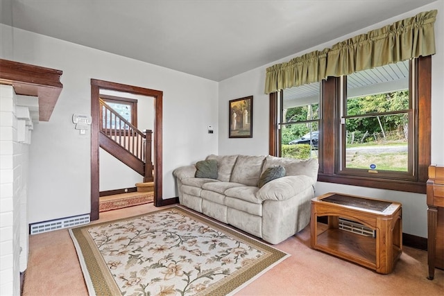 carpeted living room with plenty of natural light