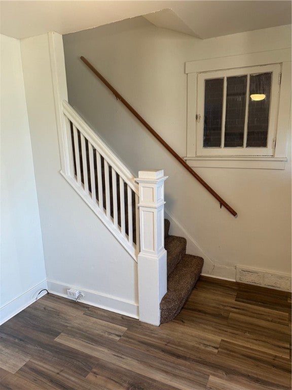 stairway featuring hardwood / wood-style flooring