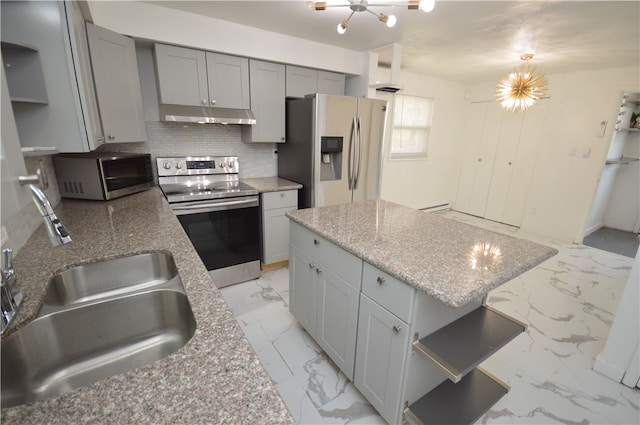 kitchen with appliances with stainless steel finishes, backsplash, gray cabinetry, light tile patterned floors, and sink