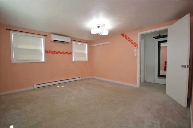 spare room featuring a baseboard heating unit, a wall mounted AC, and light colored carpet