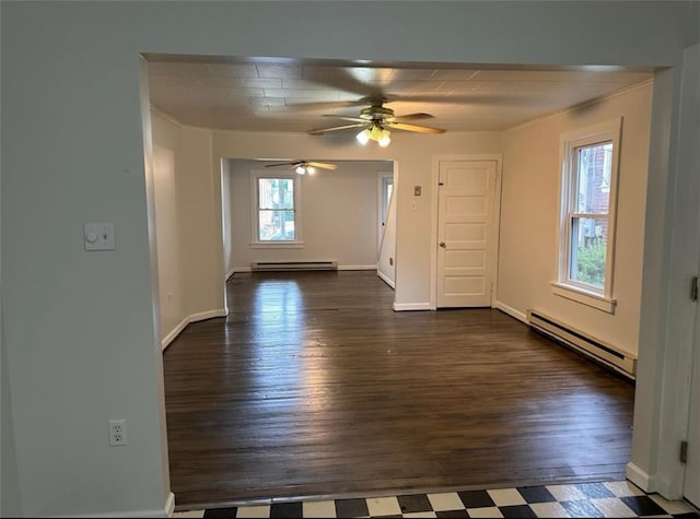 empty room with crown molding, dark hardwood / wood-style floors, ceiling fan, and a baseboard radiator