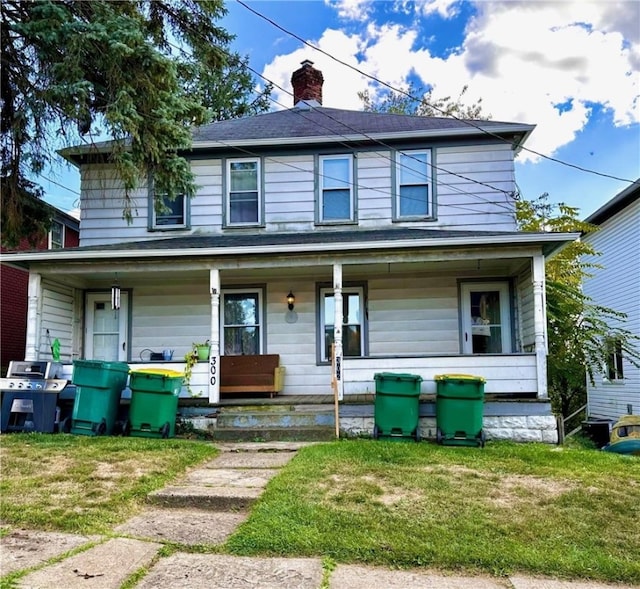 302 Penn Ave, Twp Of But Sw, PA 16045 - view of front of home with covered porch and a front yard
