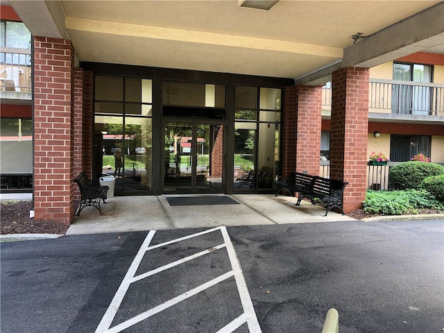 entrance to property featuring a balcony