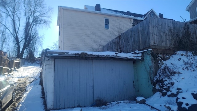 view of snowy exterior featuring cooling unit