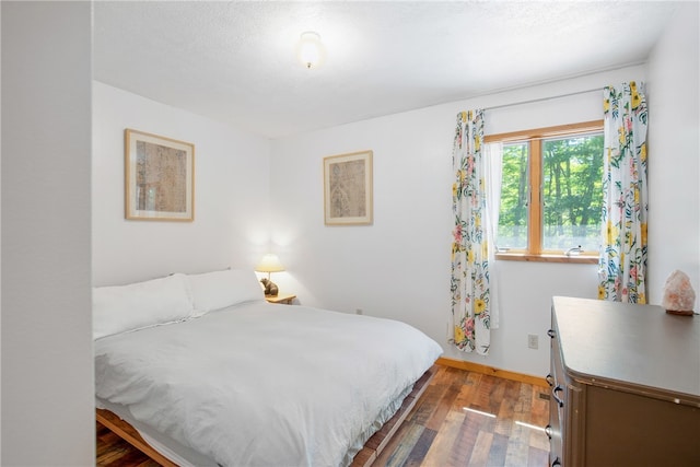 bedroom with wood-type flooring