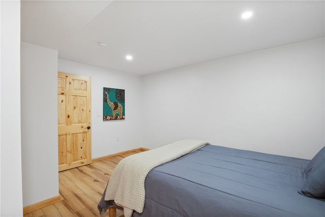 bedroom with light wood-type flooring