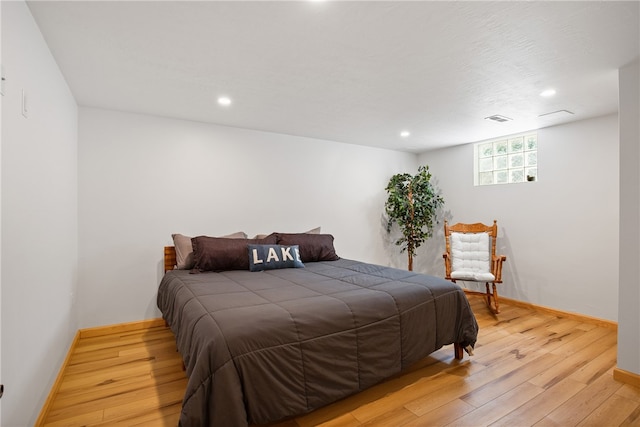 bedroom with light hardwood / wood-style flooring