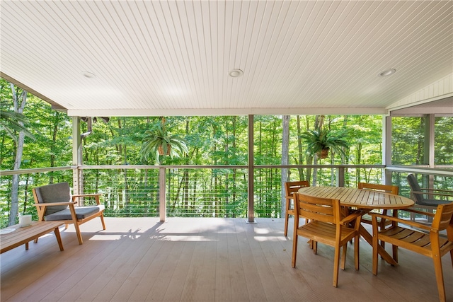 sunroom featuring wood ceiling