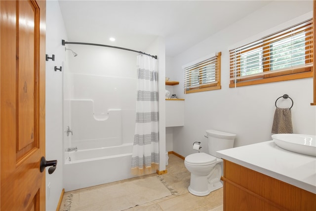 full bathroom with shower / bath combo, toilet, tile patterned floors, and vanity