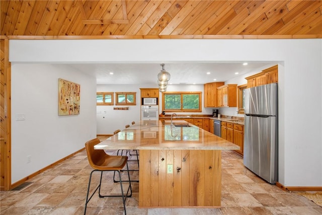 kitchen with stainless steel appliances, recessed lighting, a kitchen island with sink, wooden ceiling, and baseboards