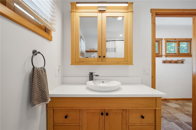 bathroom featuring tile patterned floors and vanity