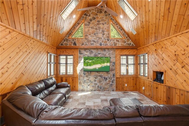 living room with high vaulted ceiling, a skylight, and wooden ceiling