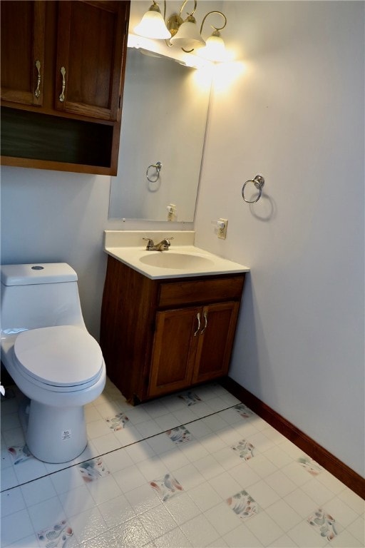 bathroom featuring vanity, toilet, and tile patterned floors