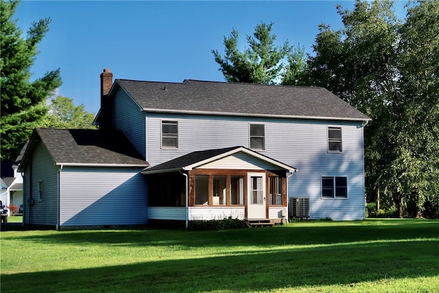 view of front of home featuring a sunroom and a front yard