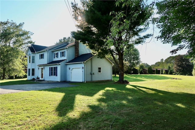 exterior space featuring a front yard and a garage