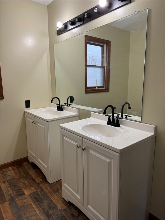 bathroom featuring vanity and wood-type flooring