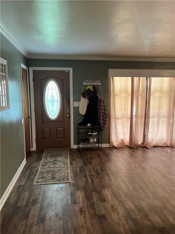 entrance foyer featuring dark hardwood / wood-style flooring and crown molding