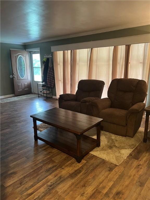 unfurnished living room with hardwood / wood-style floors and ornamental molding