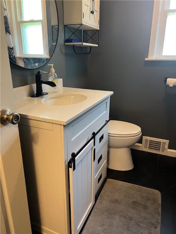 bathroom with vanity and toilet