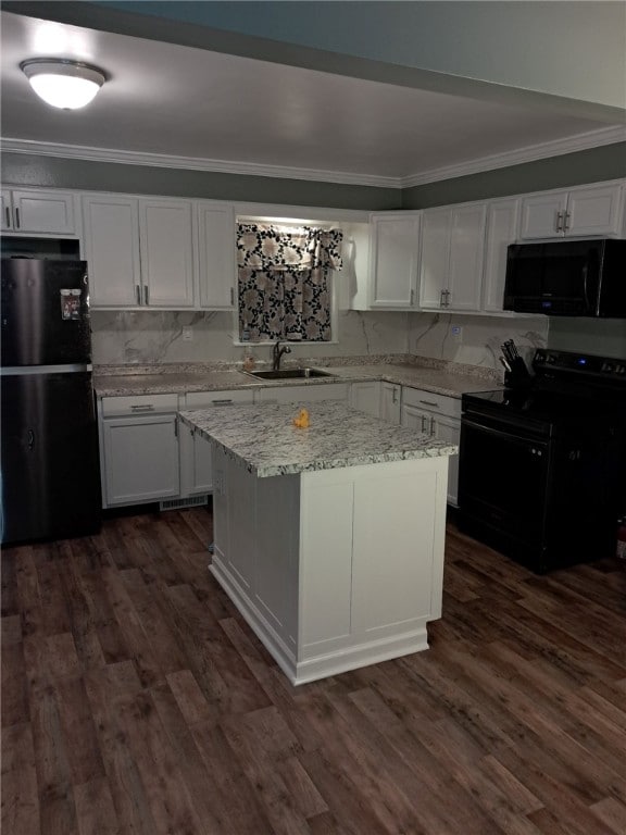 kitchen with black appliances, white cabinets, sink, a kitchen island, and dark hardwood / wood-style flooring