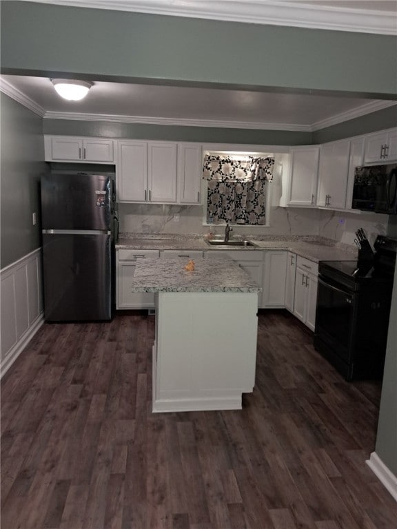 kitchen with white cabinets and black appliances