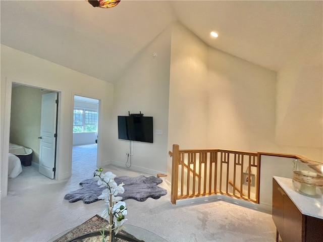 carpeted bedroom featuring lofted ceiling