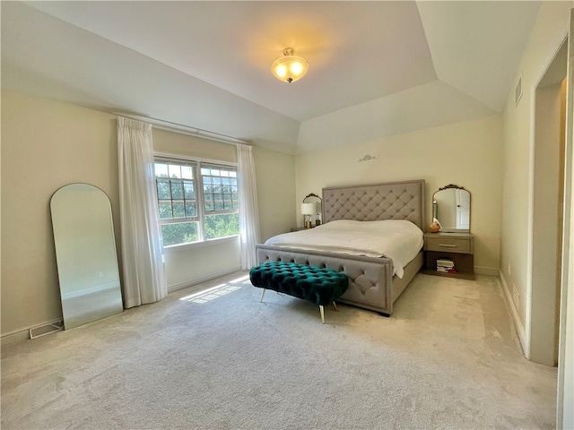 carpeted bedroom featuring vaulted ceiling