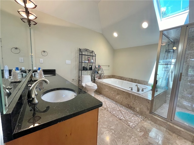 full bathroom featuring lofted ceiling with skylight, vanity, independent shower and bath, and toilet