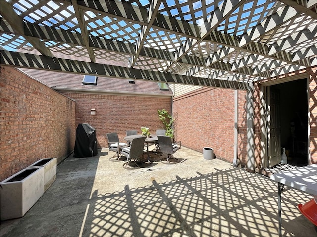 view of patio featuring a grill