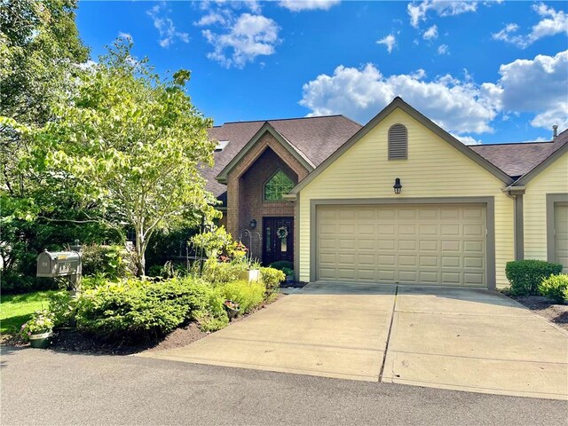 view of front of property with a garage