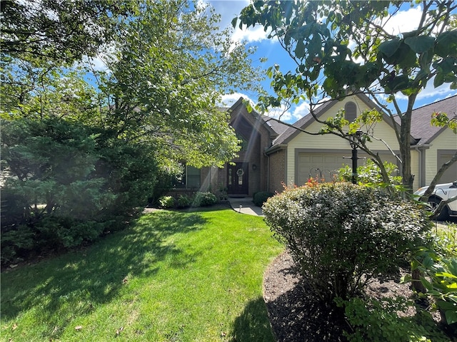 exterior space featuring a yard and a garage