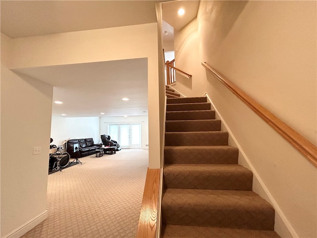 staircase with carpet floors