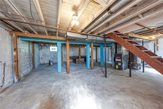 basement with heating unit and water heater