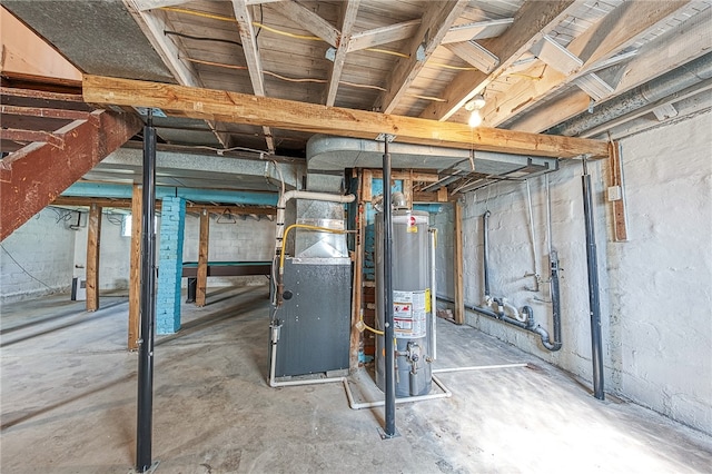 basement featuring heating unit and water heater