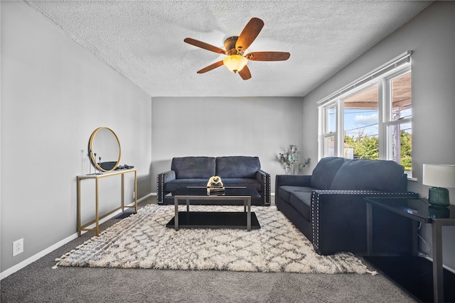 carpeted living room featuring a textured ceiling and ceiling fan