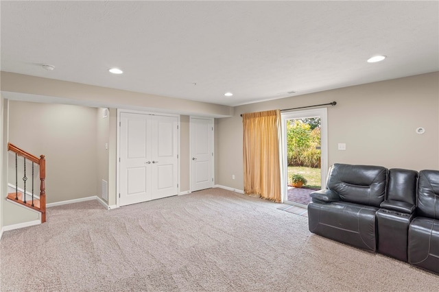 living area with light colored carpet