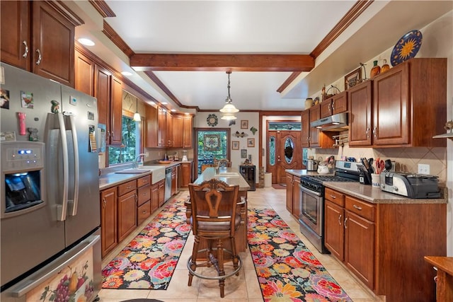 kitchen with stainless steel appliances, under cabinet range hood, decorative backsplash, light tile patterned flooring, and hanging light fixtures