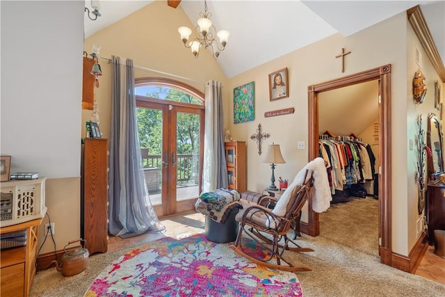 sitting room with a chandelier, french doors, carpet, high vaulted ceiling, and beam ceiling