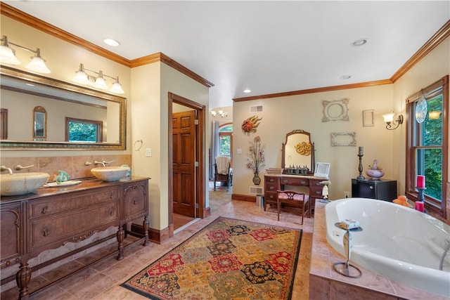 full bath featuring ornamental molding, a tub to relax in, recessed lighting, and double vanity