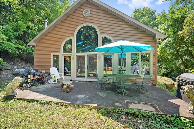 back of property featuring a patio