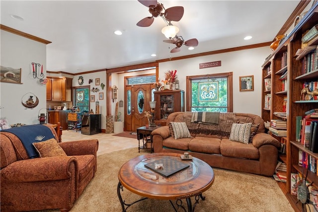 living area with crown molding, a ceiling fan, and recessed lighting