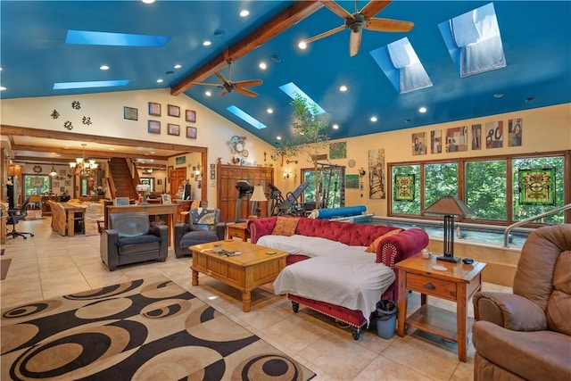 tiled living room featuring a skylight, a ceiling fan, high vaulted ceiling, a chandelier, and beamed ceiling