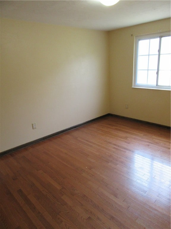 empty room featuring hardwood / wood-style floors